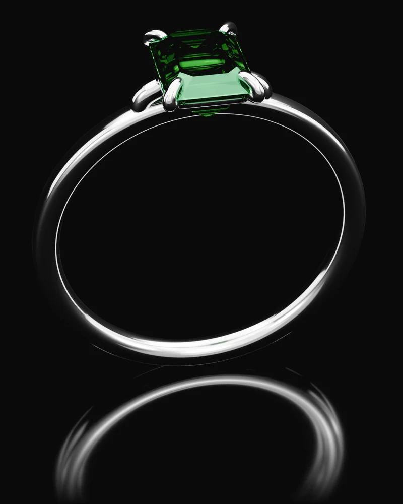The Emerald: a green emerald, step cut, in a platinum four claw setting